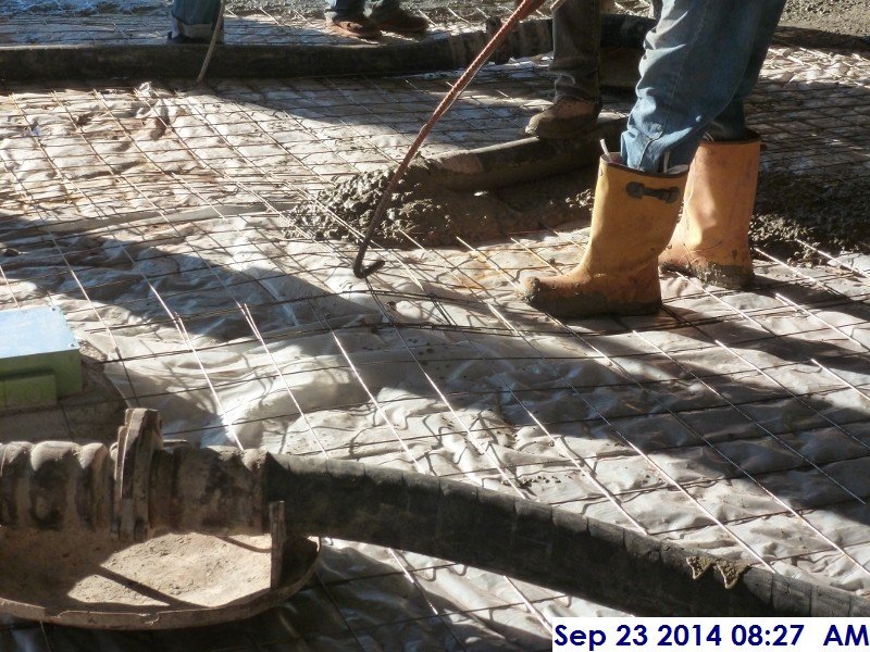 Lifting the wire mesh before pouring concrete at the Main Lobby 102 Facing South (800x600)
